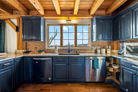 Chef's kitchen with dual dishwashers—fully equipped for groups of 21