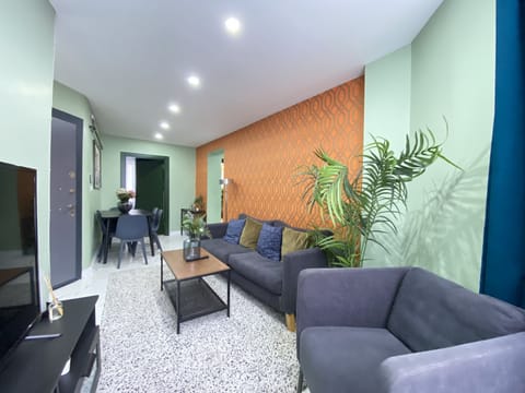 Bright modern living room with stylish decor and cozy seating.