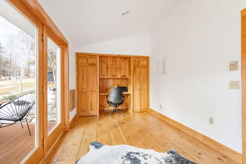 Dedicated workspace or flexible bonus room accessible through the primary bedroom with natural light