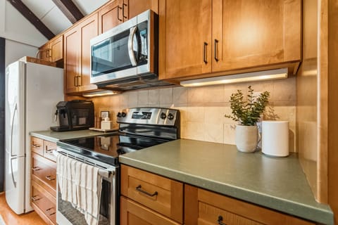 Fully equipped kitchen with modern appliances and ample prep space