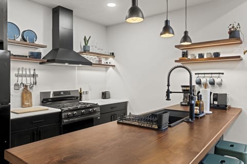Open kitchen with island—perfect for morning coffee or home-cooked meals.