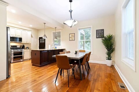 Bright open-concept dining area flows seamlessly into the kitchen and living room, ideal for entertaining guests.
