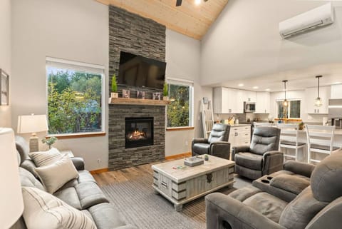 Enjoy the warm, inviting gathering space with vaulted ceilings—perfect for movie nights or relaxing after the trails!