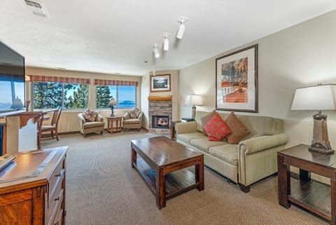 Gather comfortably in the spacious lounge with panoramic window views.