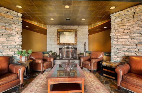 Gather for slow evenings in a refined lounge with leather chairs.