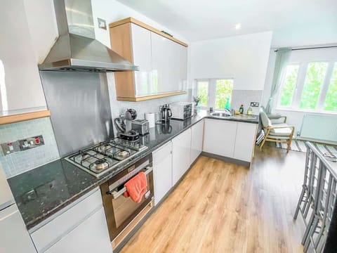 A fully equipped cooking space with modern appliances, ample storage, and countertops for meal preparation.