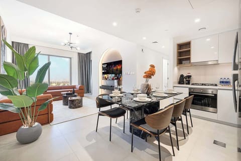 Open, airy living space with a full kitchen and chic dining area—perfect for relaxing and gathering