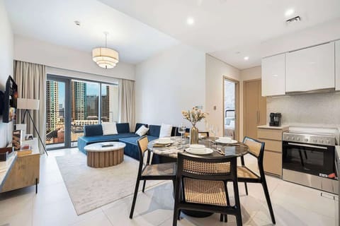 Dine with a view: the living room just steps away and the city skyline stretching out through massive windows