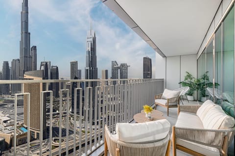 Balcony with stunning Burj Khalifa views in daylight.