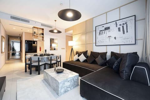 An open-layout living area designed for comfort, with a spacious seating arrangement and entertainment setup