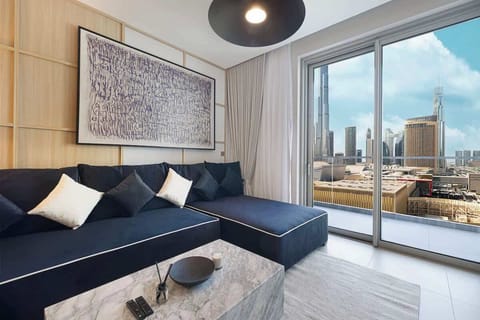 A comfortable living area designed for relaxed mornings with a recognizable Dubai skyline beyond