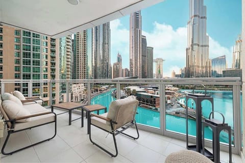 Enjoy your morning coffee on a private balcony with stunning fountain views and Dubai’s iconic skyline