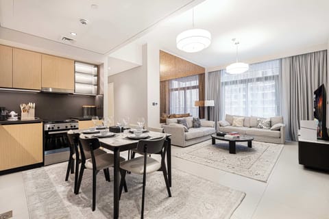 Sleek open layout featuring comfy seating, a full kitchen, and a welcoming dining area