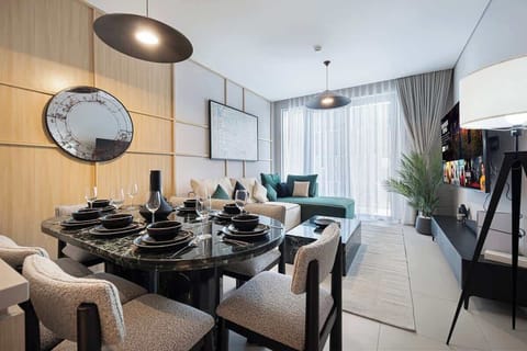 Featuring a seamless flow from living to dining, this area invites gatherings around a stylish table, ideal for family meals or entertaining guests
