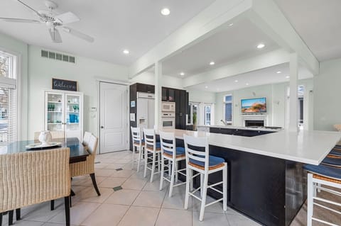 Cook together while everyone stays connected across the open living space.