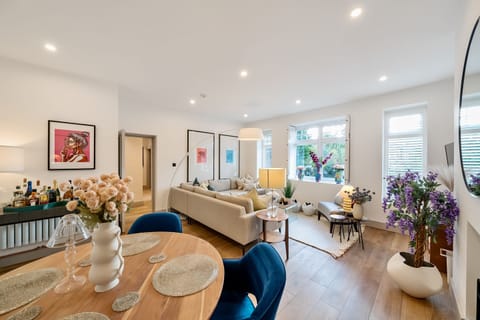Beautifully detailed living room décor flowing into an elegant dining area.