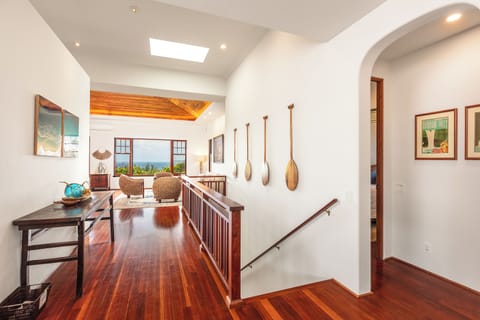 Downstairs leads to the bunkroom,  another bedroom, full bath, wet bar & gaming lanai