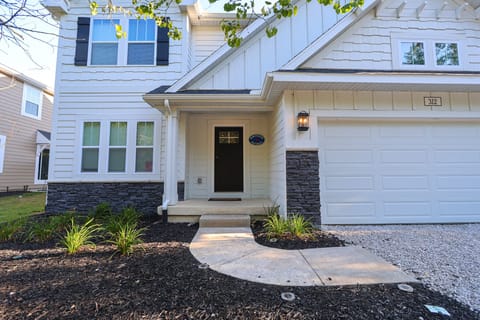 Inviting front entrance with modern curb appeal, fresh landscaping, and easy access into this bright, spacious South Haven getaway – perfect for families or groups looking for comfort and convenience.