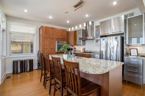 Gather around the granite island, where style meets functionality.