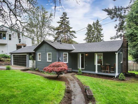 Charming exterior with private access. This is the front view of the home, your unit will be at the lower daytime basement level.  You will have access through the private entrance in rear of house.