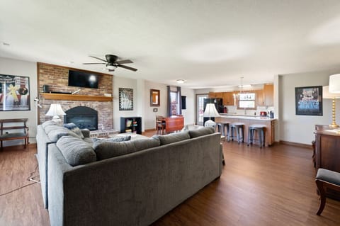 Living Room | Sectional Sofa | Ceiling Fan & Kitchen View