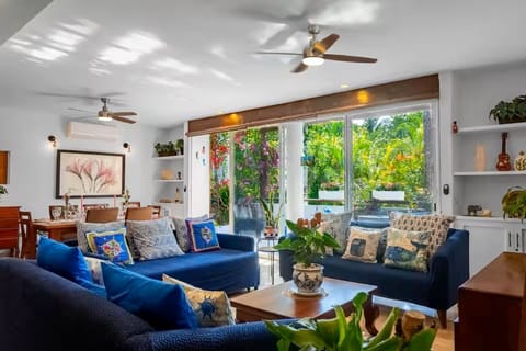 Living room with view of balcony and dining area