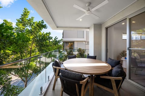 Step outside for morning coffee or casual meals, with a covered balcony extending the living space outdoors.