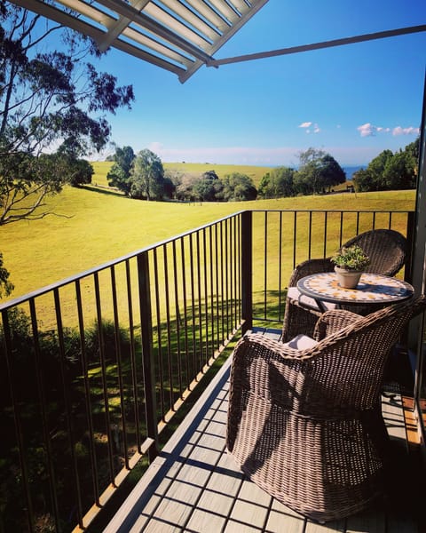 View from the upstairs deck to the farm and coastline.