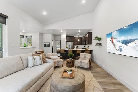 Sink into your plush sectional and enjoy seamless indoor-outdoor living in this bright, modern space with gourmet kitchen.