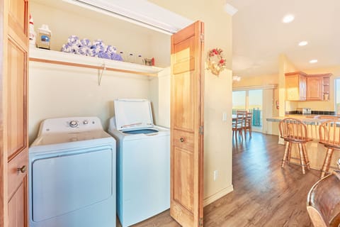 Enjoy the convenience of a full-size washer and dryer, plus complimentary laundry detergent