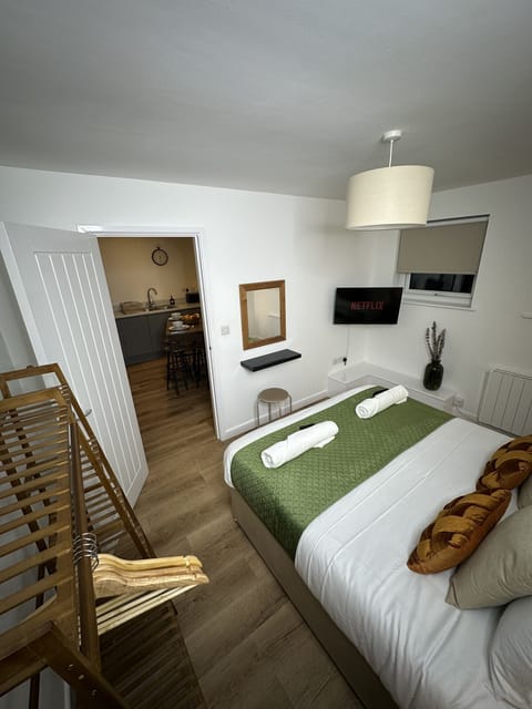Bedroom 2 with King Bed(or two singles), clothes rack and smart TV