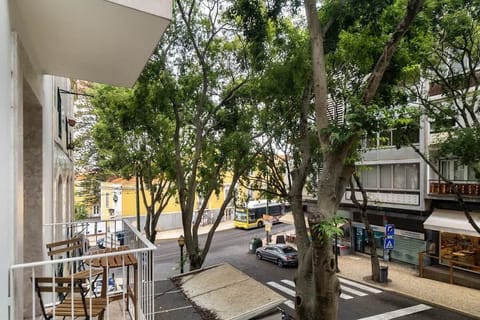 Enjoy the fresh air and city views from the private balcony. Relax with a cup of coffee!