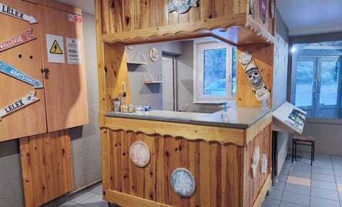 The welcoming reception area features rustic wooden decor, offering a cozy ambiance for guests arriving at the resort.