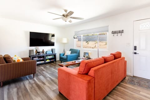 Living Room | Orange Sectional Sofa | TV & Board Games