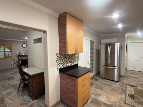 Desk, refrigerator in kitchen