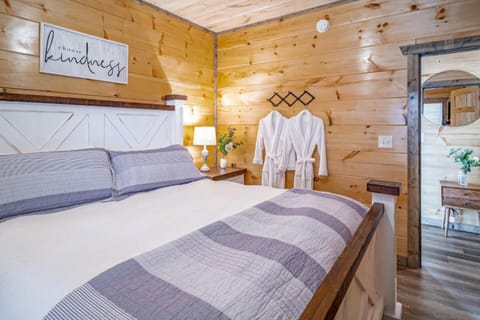 Bedroom Retreat: Unwind in a stylish, well-lit space featuring rustic wood accents and charm!
