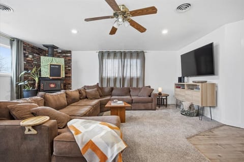 Cozy sofa in the living room area with 65" television
