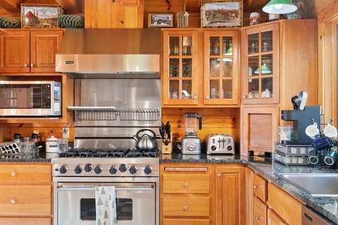 Cook together in a warm, wood-lined kitchen - fully stocked for winter comfort food