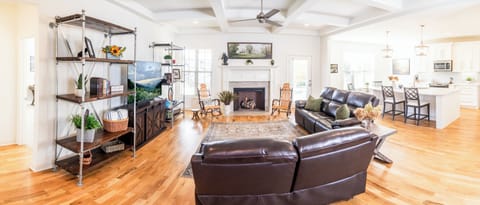 Livingroom has 65" QLED TV, Stereo sound, Spectrum Cable, and Fast Internet