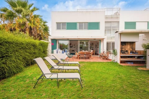 Backyard with Barbecue. Dining and seating areas.