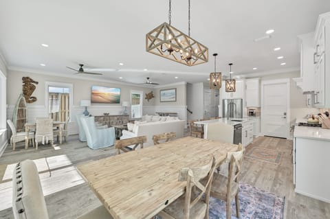 Dining space with a light wood table and seating for six.