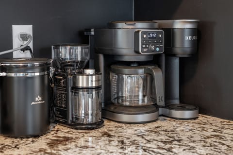 Fully equipped coffee station with drip, Keurig, grinder, and pour-over options
