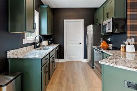 Galley-style gourmet kitchen with high-end appliances and ample prep space for group meals