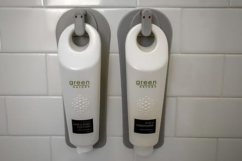 Enjoy spa-like convenience with wall-mounted shampoo and conditioner.