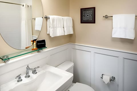Get ready easily at the bright vanity with generous counter space.