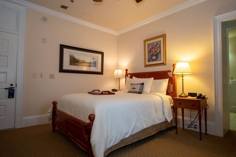 Unwind into crisp linens with warm bedside lighting.