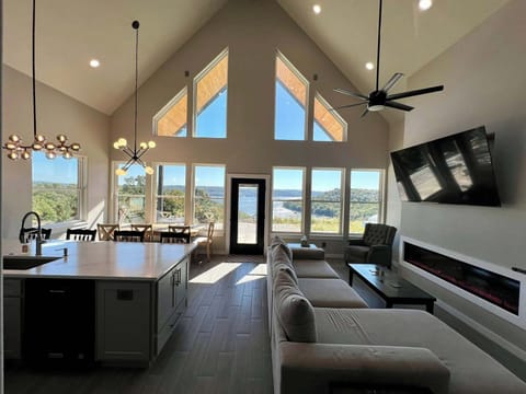 Open kitchen with lake views from everywhere! Large electric fireplace.