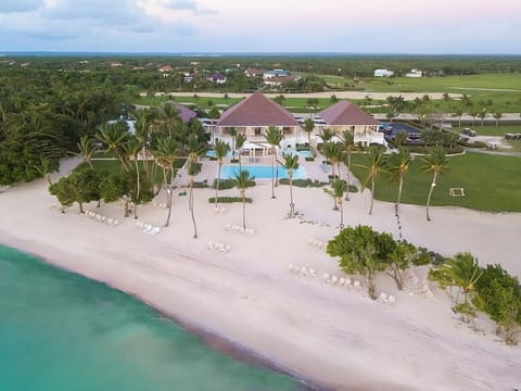 Escape to a breathtaking beachfront estate with turquoise waters.