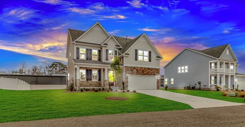 Exterior View: Stunning curb appeal with vibrant skies and lush greenery awaits your relaxation!