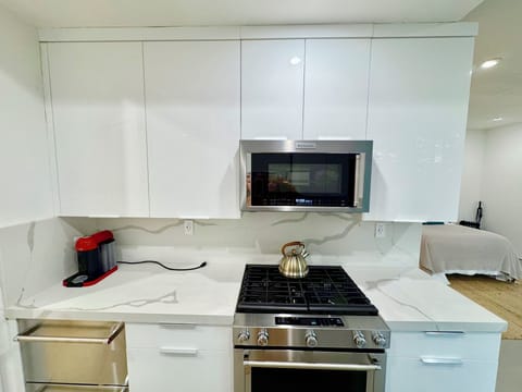 Kitchen with full size range and drawers for refrigerator and freezer